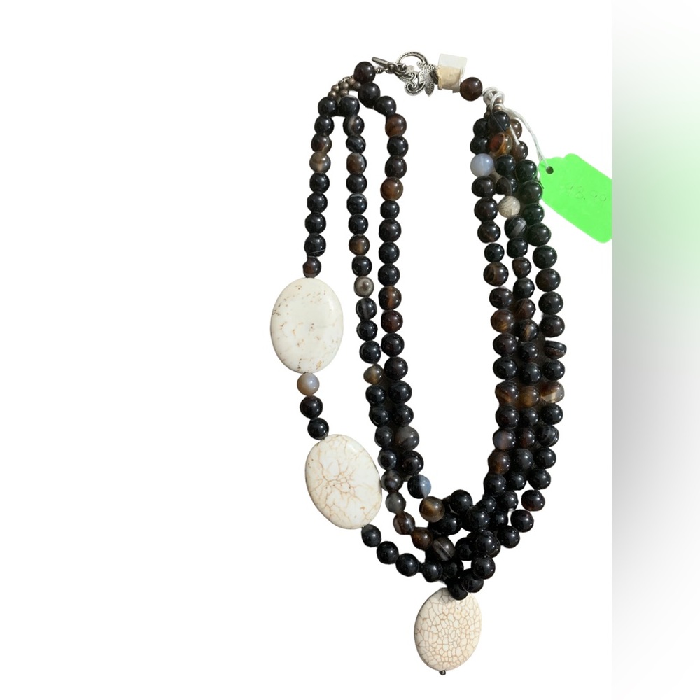 Tiger eye and flat oval magnesite three tier necklace.